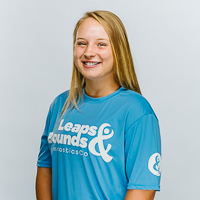 Smiling headshot for Leaps & Bounds Coach Abbie Dambach
