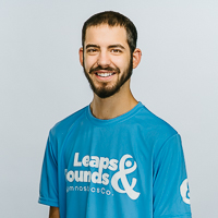 Smiling headshot for Leaps & Bounds Manager and Coach Michael Fenechi