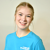 Smiling headshot for Leaps & Bounds Coach Lacey Kennedy